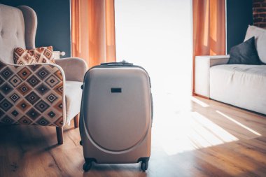 Suitcase in a bright modern apartment