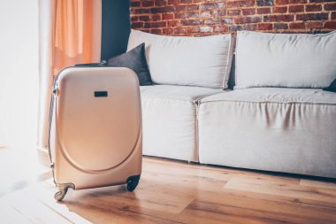 Suitcase in a bright modern apartment