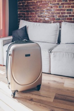 Suitcase in a bright modern apartment