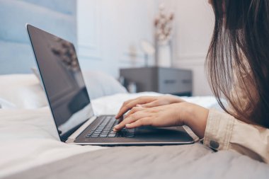 Work from home concept with woman working on laptop computer