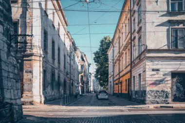Traditional buildings in a cobblestone street in historical Old town of Lviv.