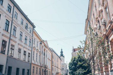 Facades of houses in Lviv, old buildings against the sky