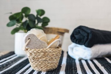 Spa wellness setting concept. Spa accessories on a white background. Towel, massage brush, pumice stone, washcloth, candle.