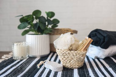 Spa wellness setting concept. Spa accessories on a white background. Towel, massage brush, pumice stone, washcloth, candle.