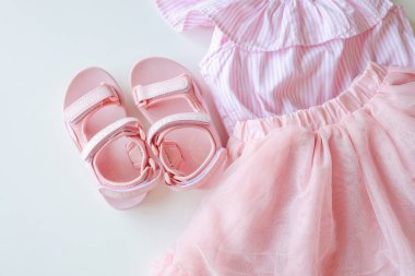 Children's casual summer clothes, shorts, T-shirt, flat lay sandals.
