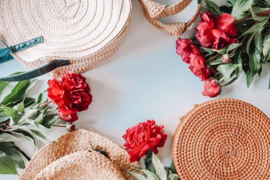 Flat lay top view wicker accessories, hat and bags