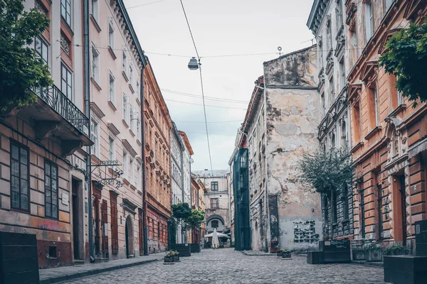 Traditional buildings in a cobblestone street in historical Old town of Lviv.