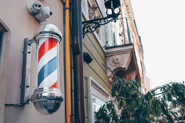 Barber shop pole. Logo of the barbershop, symbol. Barbershop pole, retro. Old fashioned vintage barber shop pole. A classic barber logo.
