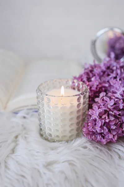 Beautiful Candle Close Background Book Lilacs — Foto Stock
