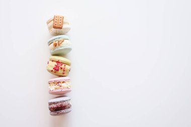 Macaroons on white background flat lay, space for text