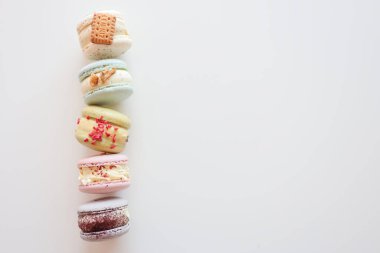 Macaroons on white background flat lay, space for text