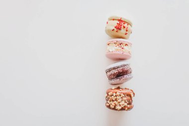 Macaroons on white background flat lay, space for text