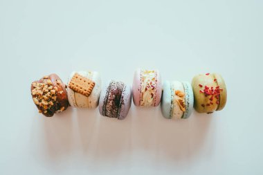 Macaroons on white background flat lay, space for text