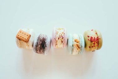 Macaroons on white background flat lay, space for text