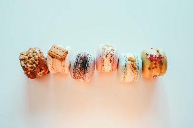Macaroons on white background flat lay, space for text