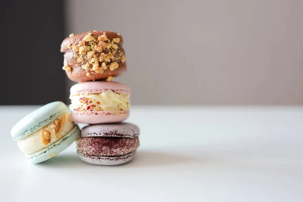 Macaroons close-up on a white table in a cafe
