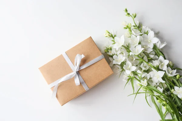 Cardboard Gift Box Bow Flowers White Background — стоковое фото