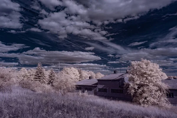 infrared photography - ir photo of landscape under sky with clouds - the art of our world in the infrared spectrum