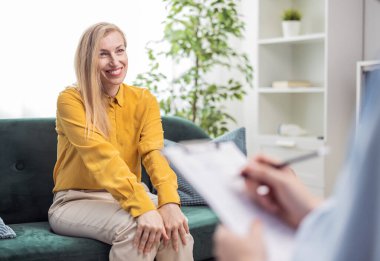 Happy mature woman smiling, patient of psychologist doctor satisfied with service, mental healthcare concept