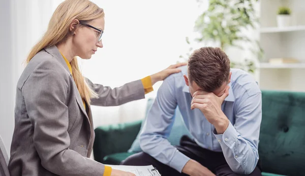 Mature Blond Woman Psychologist Helps Stressed Man Talk Motivation Health — Stok fotoğraf