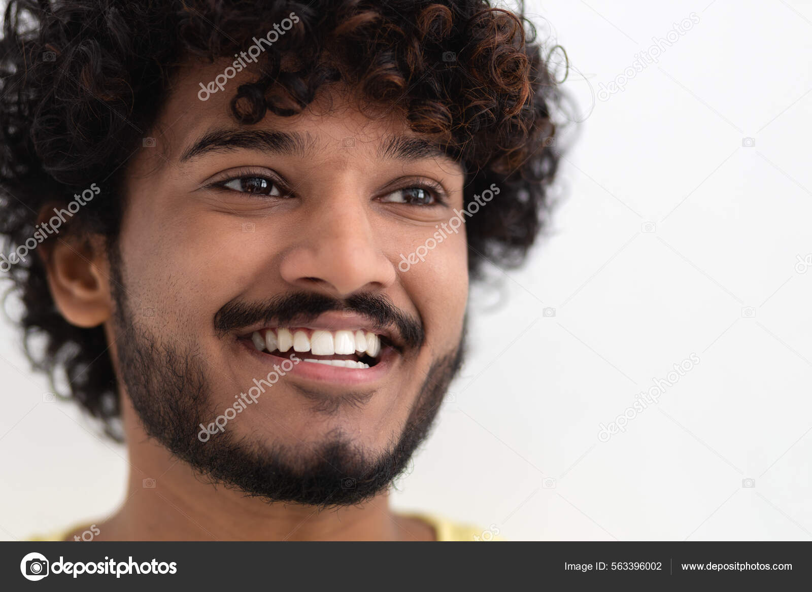 Portrait Young Happy Positive Indian Man White Teeth Curly Hair Stock Photo  by ©KucherAndrey 563396002