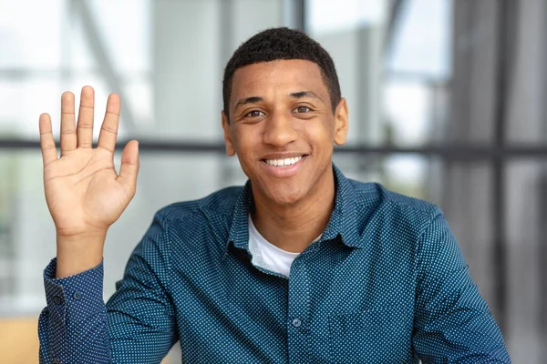 Remote work, online interview, video conference concept. Video call screen with smiling African American man introducing himself. Headshot of a positive male looking at the camera and smiling friendly