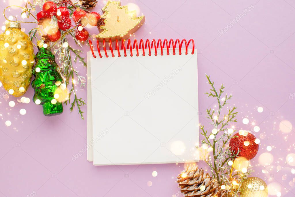 Christmas mosk up wish list on purple background, notebook to-do list, decorations and bohen. Merry Christmas, Happy Holidays and Happy New Year. Xmas background