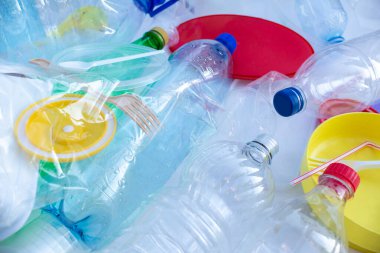 Reuse garbage, recycle, plastic free. Multi-colored plastic trash on a white background. Ecology concept. No plastic collection poster banner concept template