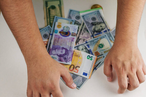 man holding a money in a hand