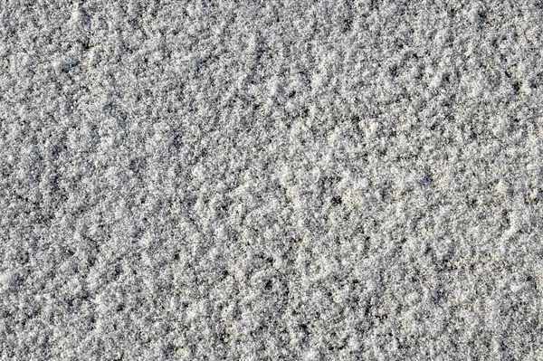Struttura della neve, vista dall'alto della neve su asfalto. Texture per il design — Foto Stock