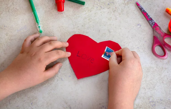 St. Valentines day theme. Crafts concept. Kid makes art project . High quality photo