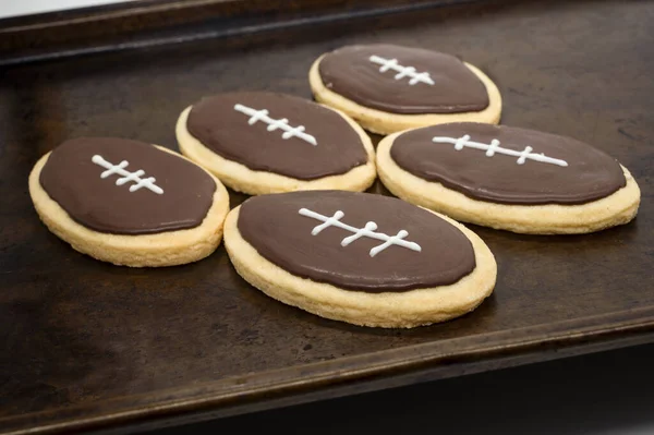 Super Bowl party cookies. Football shape cookies. Home made cookies concept. High quality photo