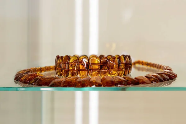 Amber Bracelet Beads Glass Shelf Close — Stock Photo, Image