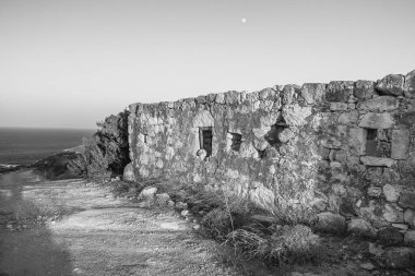 Abandoned house on the coast of Milos Island, Cyclades, Greece