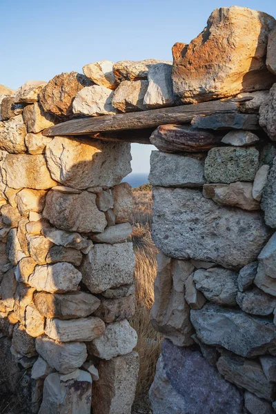 Abandoned house on the coast of Milos Island, Cyclades, Greece