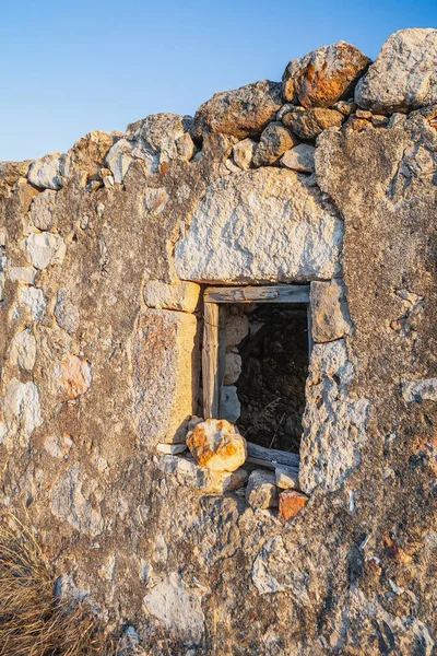 Abandoned house on the coast of Milos Island, Cyclades, Greece