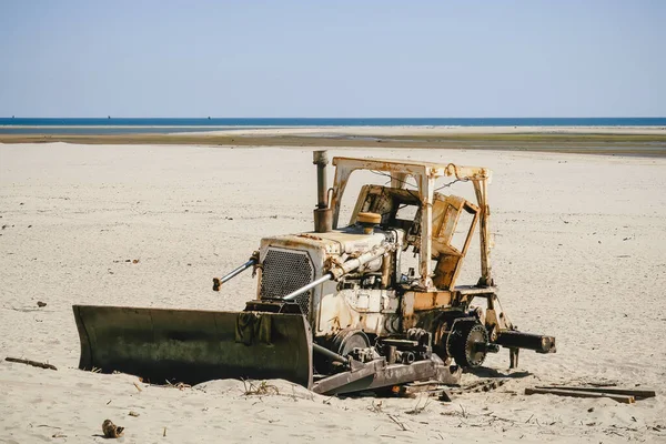 Abandoned bulldozer on a beach, Morondava, Madagascar