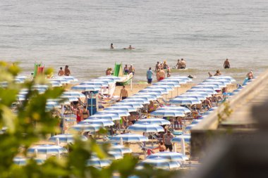 Beach with bathers in summer. Rimini, Italy, High quality photo