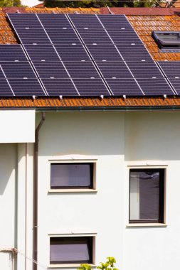 Solar panels on pitched tiled roof, Rimini, Italy. High quality photo