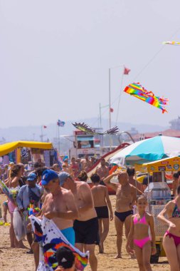Beach with bathers in summer. Rimini, Italy, editorial image. High quality photo