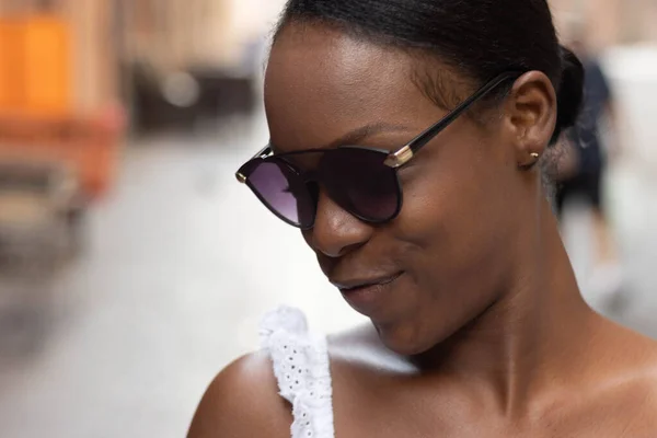 Portrait of African American woman dressed in white getting to know Europe, Ferrara. Italy. High quality photo