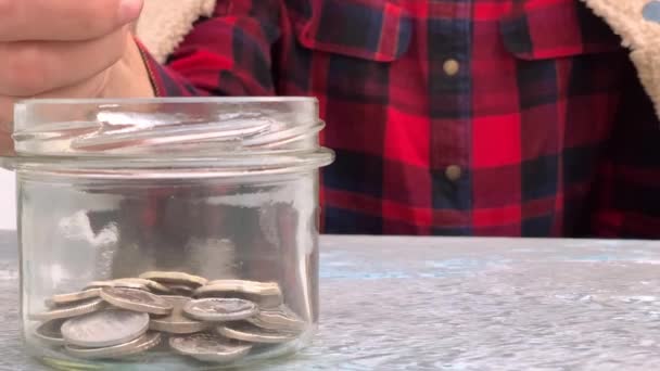 Slow Motion Conceptual Video Young Woman Throwing Coins Glass Jar — ストック動画