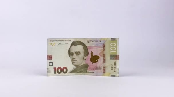 Paper money. Ukrainian hryvnia in denominations 100 hryvnias isolated on a white background. Portrait of Taras Shevchenko, Ukrainian poet on a banknote — Stock Video