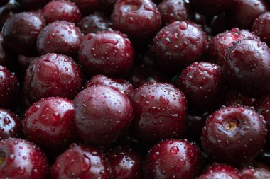 Kiraz arkaplanı. Bir damla suyla siyah tatlı kiraz