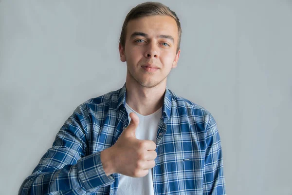 Portrait Cheerful Man Shirt Smiling Showing Thumbs Camera Isolated Gray — ストック写真