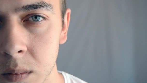 Half Young Man Face While Looking Camera Blank Space Text — Vídeos de Stock