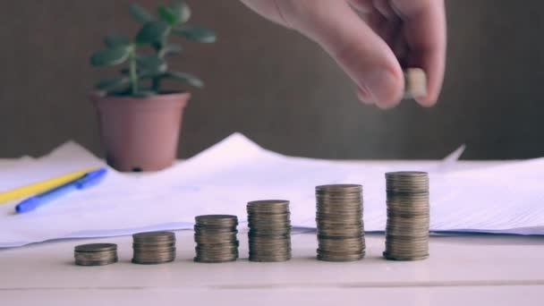 Close Hand Puts Stack Coins Table Saving Money Growth Concept — Vídeos de Stock