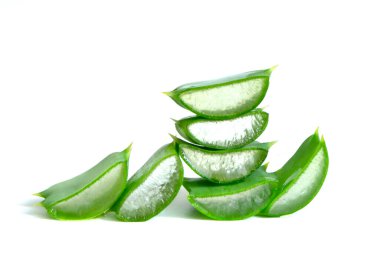 heap of aloe vera fresh sliced leaves isolated over white background