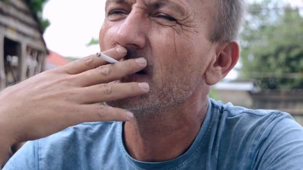 Caucasian Middle Aged Man Smoking Cigarette Outdoor — Video