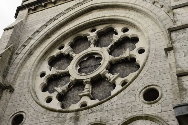ancient design on the facade wall of st fin barre cathedral